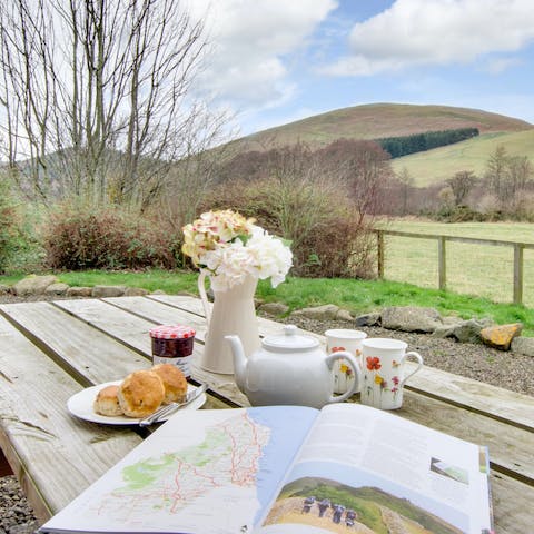 Enjoy a pot of tea on the terrace as you map today's hiking route