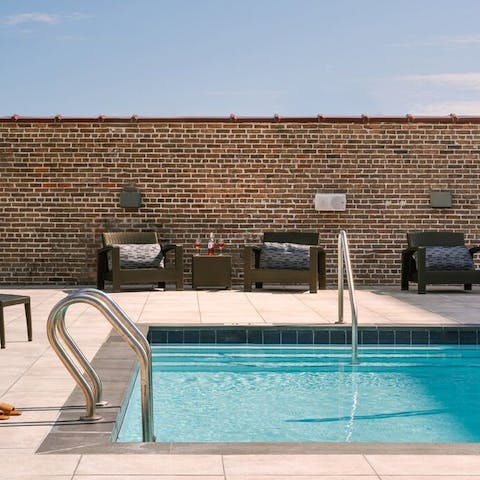Sunbathe by the sparkling rooftop pool