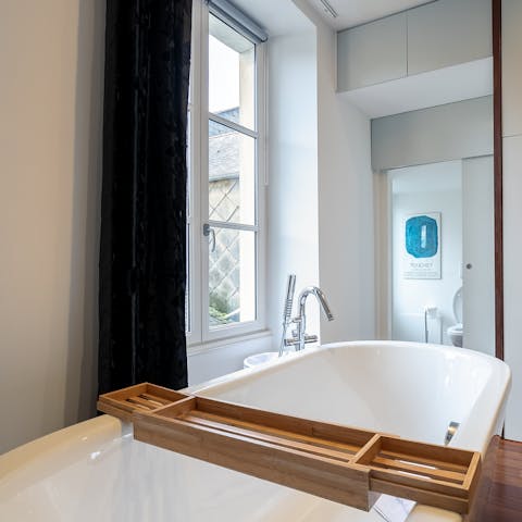 Indulge in a long hot soak in the tub while gazing out of the window