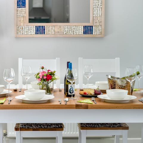 Share a homecooked meal and a bottle of wine around the dining table