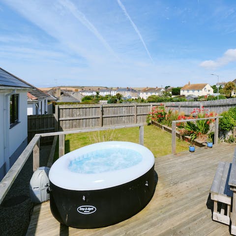 Soak your cares away in the hot tub on a warm afternoon