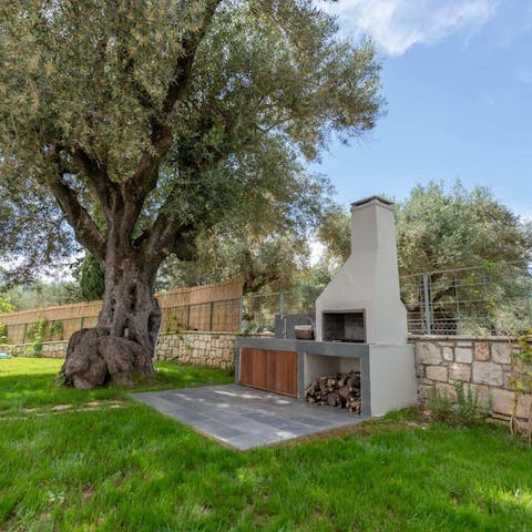Cook lavish barbecues at the garden's summer kitchen, beneath an olive tree