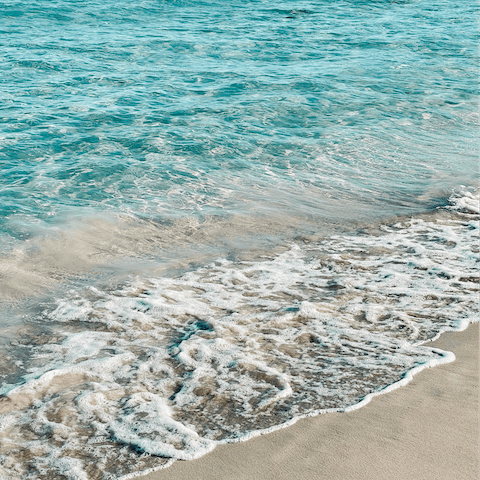 Make a day trip to Cala Benirrás and spend a day on its white powder sands, around thirty minutes' drive 