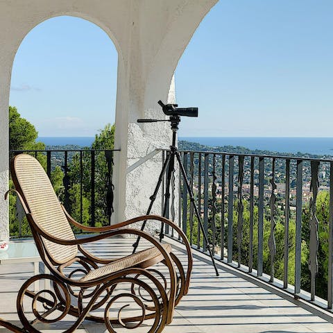 Recline on the balcony and admire the sparkling Med before you
