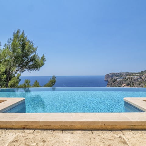 Marvel at breathtaking Balearic vistas from the waters of the infinity pool