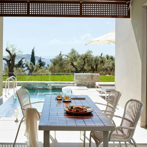 Serve up bowls of juicy olives and Greek wine on the terrace