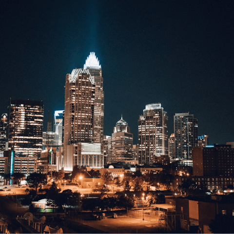 Visit a rooftop bar in Charlotte and take in the stunning skyline – a six minute drive away