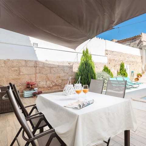 Serve up local Mallorcan delicacies at the poolside alfresco  dining area 