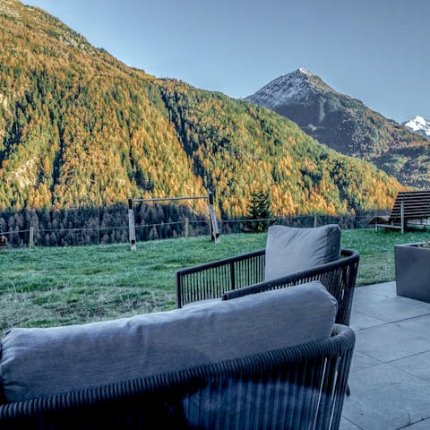 Sit back and enjoy the sun setting over the mountains from the terrace