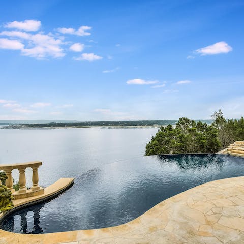 Admire the views over the lake from the infinity pool