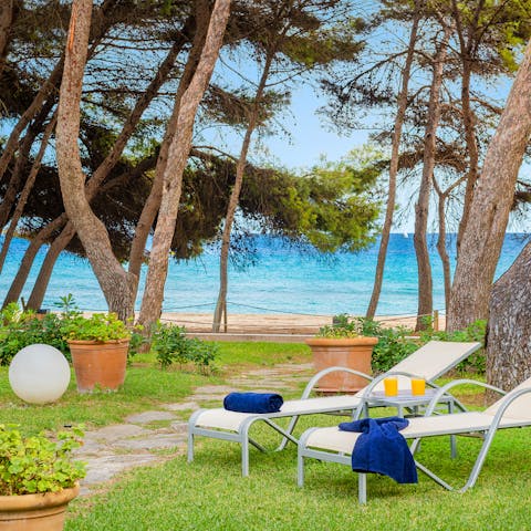 Head out through the garden to the golden sands of Platja d'Alcudia