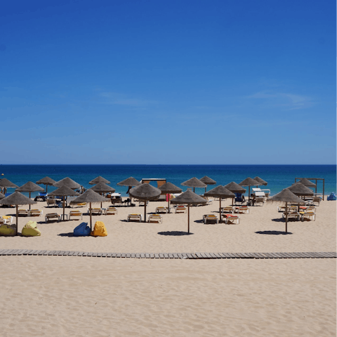 Take a three-minute drive to Praia da Luz beach