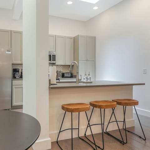 Sip your morning coffee on the sleek breakfast bar stools 