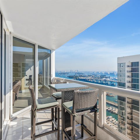 Admire the views across the city from the private balcony