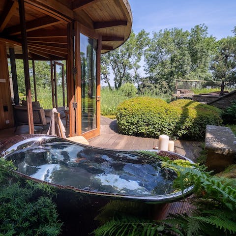 Indulge in a soak in the outdoor bathtub on the rooftop garden