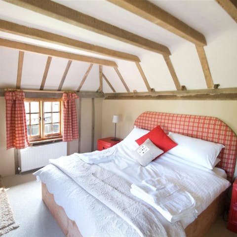 Fall asleep underneath traditional beams in the comfortable bedrooms