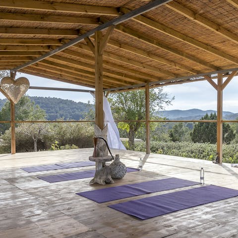 Perfect your downward facing dog in the outdoor yoga studio