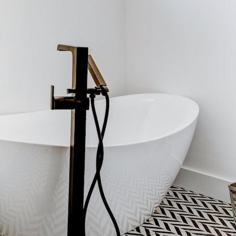 Treat yourself to a leisurely soak in the free-standing tub
