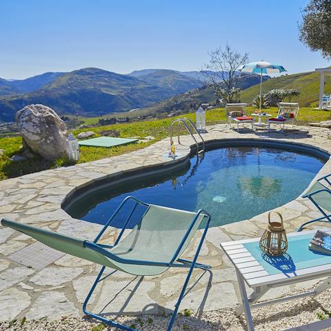 Lie up beside the little swimming pool and admire the Sicilian hills