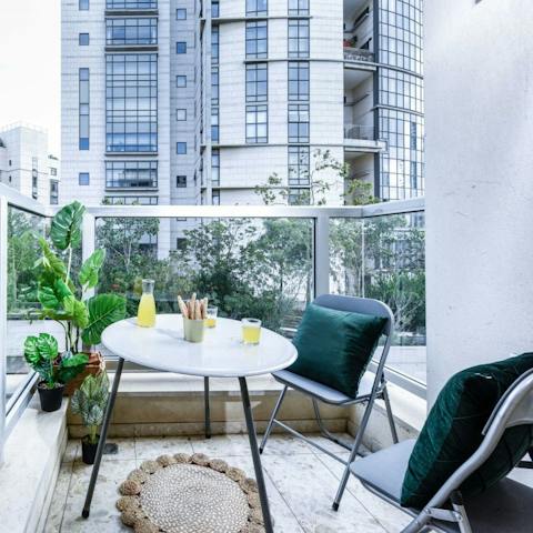 Enjoy evening drinks on your private balcony, a rare find in Tel Aviv apartments