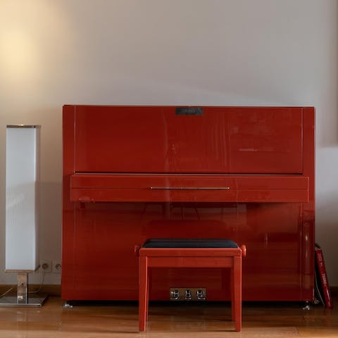 Play a tune on the grand red piano