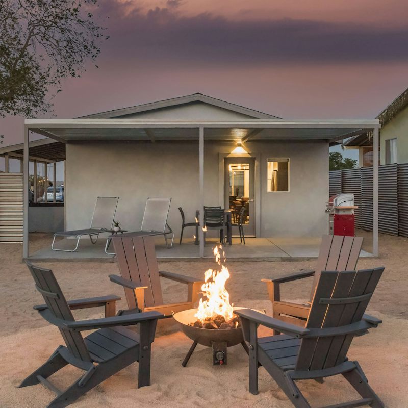 Toast marshmallows over the fire pit as twilight falls