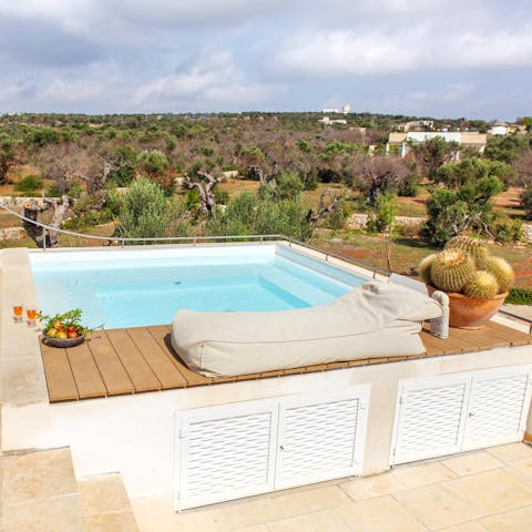 Soak in the rooftop hot tub while you gaze out at views of the trees surrounding you