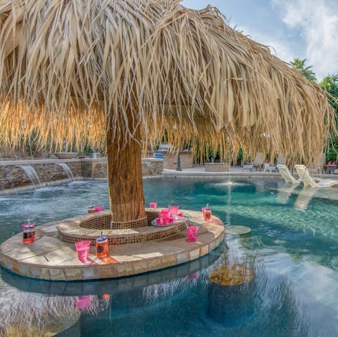 Have your very own pool party around the palapa bar