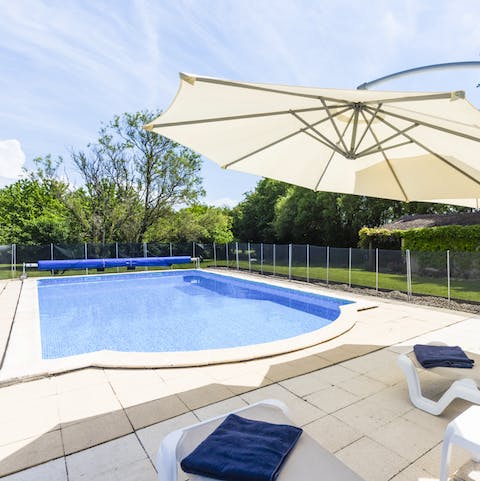 Play games in the heated swimming pool before dozing off on one of the loungers