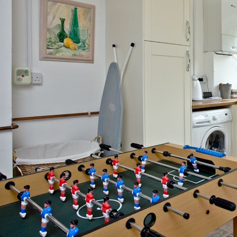 Challenge someone to a foosball tournament or board game