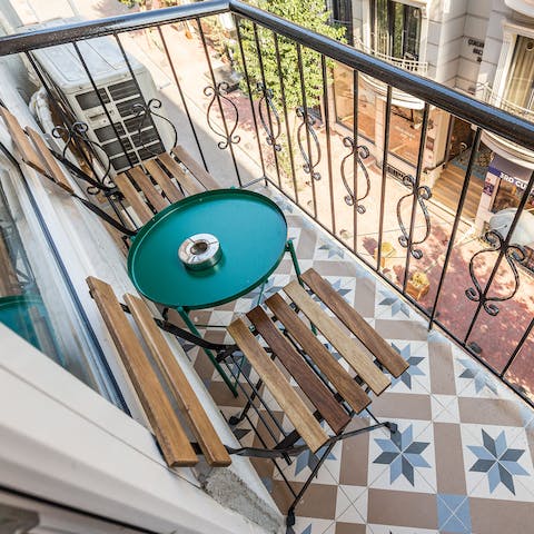 Relax on the balcony with its ornate tiles