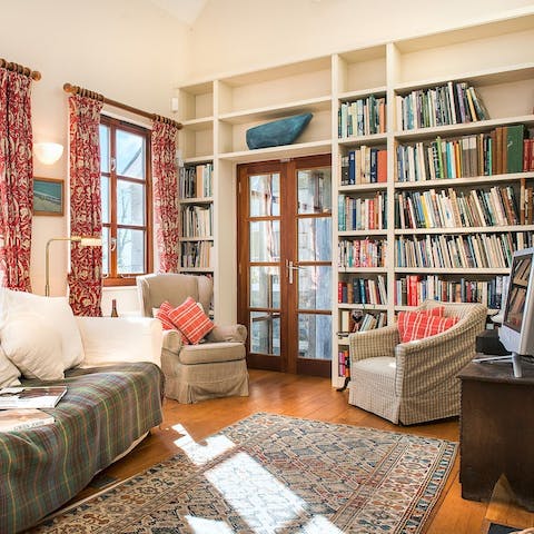 Pick a book off the shelf and curl up in an armchair, or stretch out on the sofa