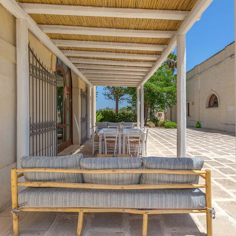 Enjoy long, lazy lunches in the shade of the bamboo pergola