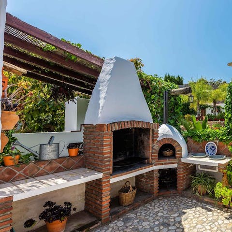 Prepare barbecued feasts in the outdoor kitchen