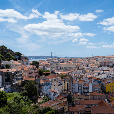 Look out over the city rooftops from your hilltop location in Graça 