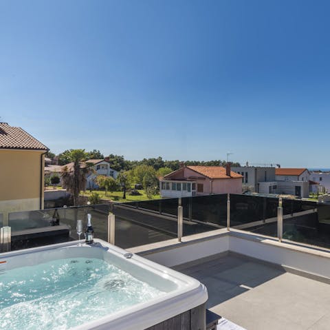 Watch the sunset whilst soaking in the rooftop hot tub