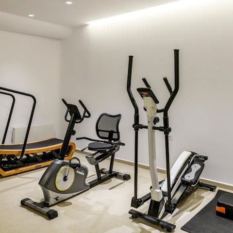 Stay on top of your fitness goals with a workout in the private gym