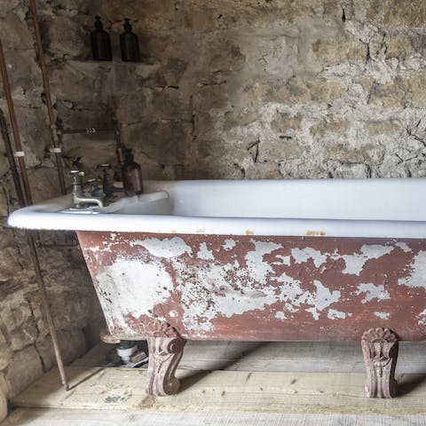 Have a soak in the vintage free-standing bathtub