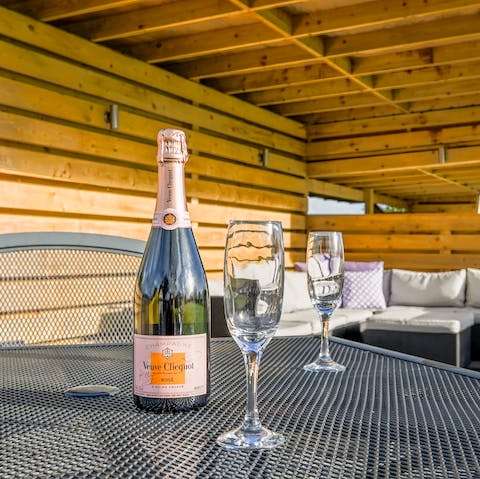 Sip champagne on the outdooor sofas on a balmy evening