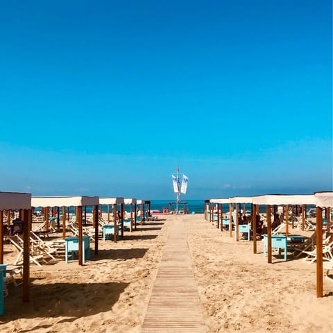 Drive eight minutes to Spiaggia Libera Viareggio and sprawl out on the sandy beach