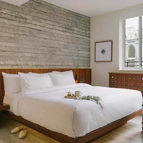 Sink into the comfortable bed after a long day of touring the Big Apple