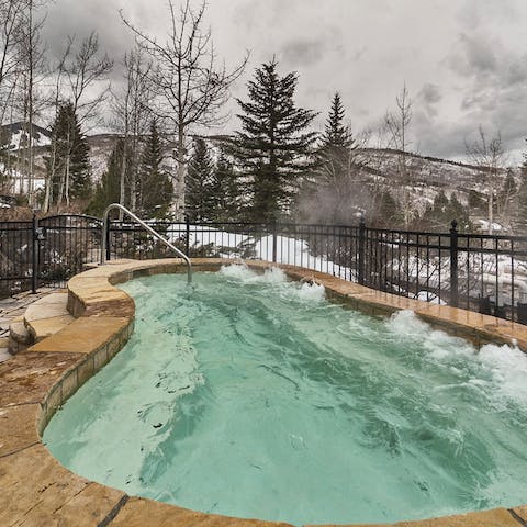 Stay warm among the snowy mountains in the heated pool