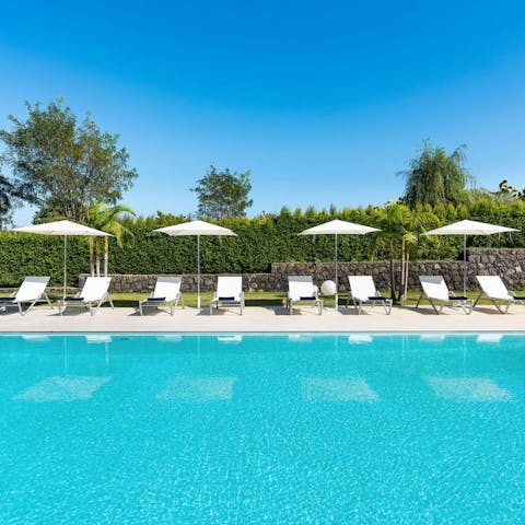 Soak up the sun from the poolside loungers