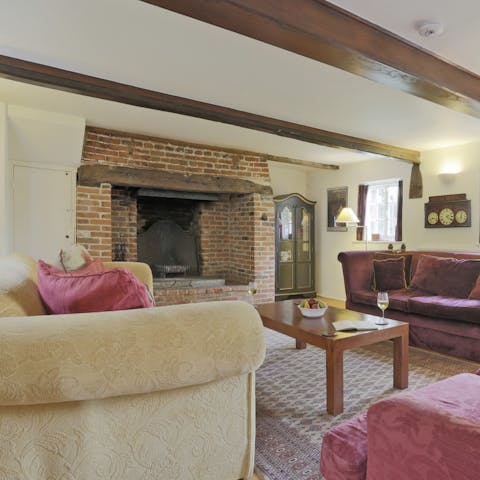 Wind down with a glass of wine in front of the roaring fire