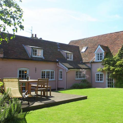 Smell the roses and soak up the evening sun in the pretty garden