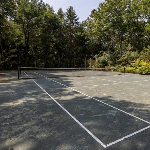 Practice your game on the private tennis court