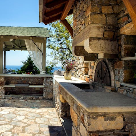 Fire up the traditional stone barbecue and bread oven to make fresh, Greek fare