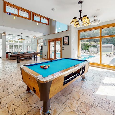 Play pool and shuffleboard in the expansive games room