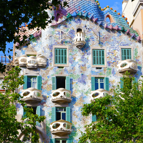 Visit the striking facade of Casa Batlló, just an eight-minute walk from home