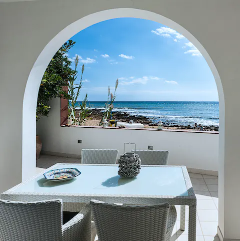 Enjoy long alfresco lunches with a gentle sea breeze blowing through the archway